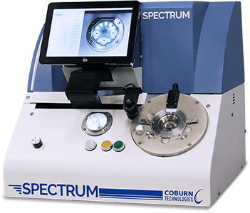 Spectrum Prismatic Lens Blocker by Coburn Technologies, machine facing front with screen turned on.
